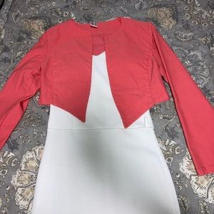 A white dress with a pink jacket